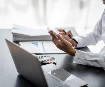 Investor reviewing figures at a desk